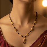 Gold-Plated Black and Designer Golden Beads Necklace worn by a model showcasing its elegance.