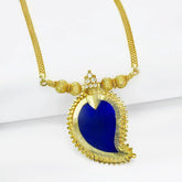 Alluring Premium Gold Plated Big Mango Pendant Necklace with blue semi-precious stones on a designer Urvashi chain.