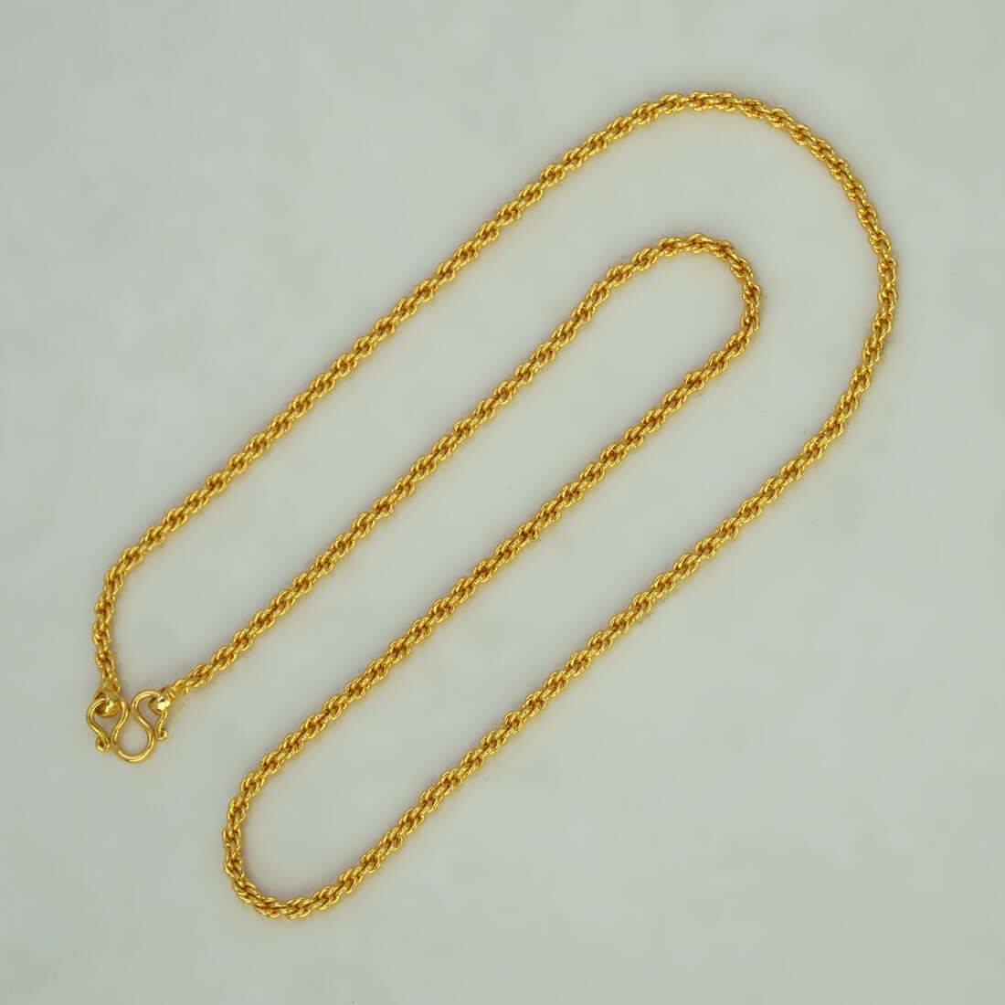 Gold Plated Coir Design Anjali Chain 24" displayed on a light background, highlighting its elegant design.