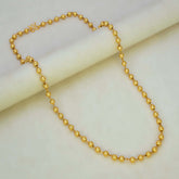 Unisex Gold Plated Big Ball Bead Chain displayed elegantly on a soft surface, showcasing its smooth and shiny finish.
