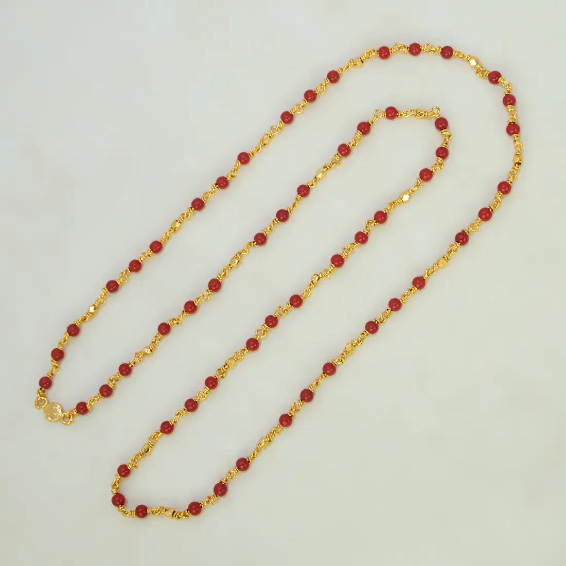 Gold Plated Coral Red Beads Chain featuring gold-plated links and vibrant coral red beads.
