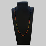 Gold Plated Coral Red Beads Chain displayed on a necklace bust, showcasing vibrant coral-red beads and gold accents.