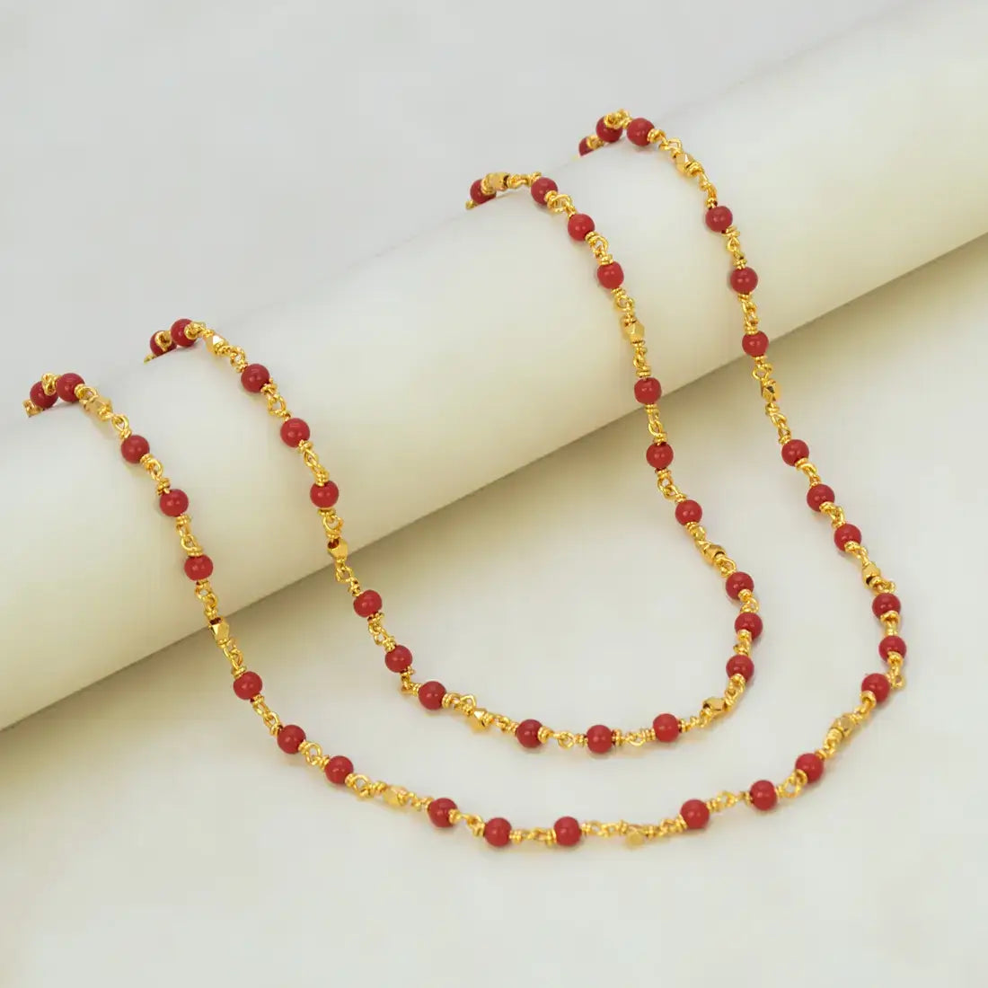 Gold Plated Coral Red Beads Chain featuring vibrant coral red beads on a fine gold-plated link chain.