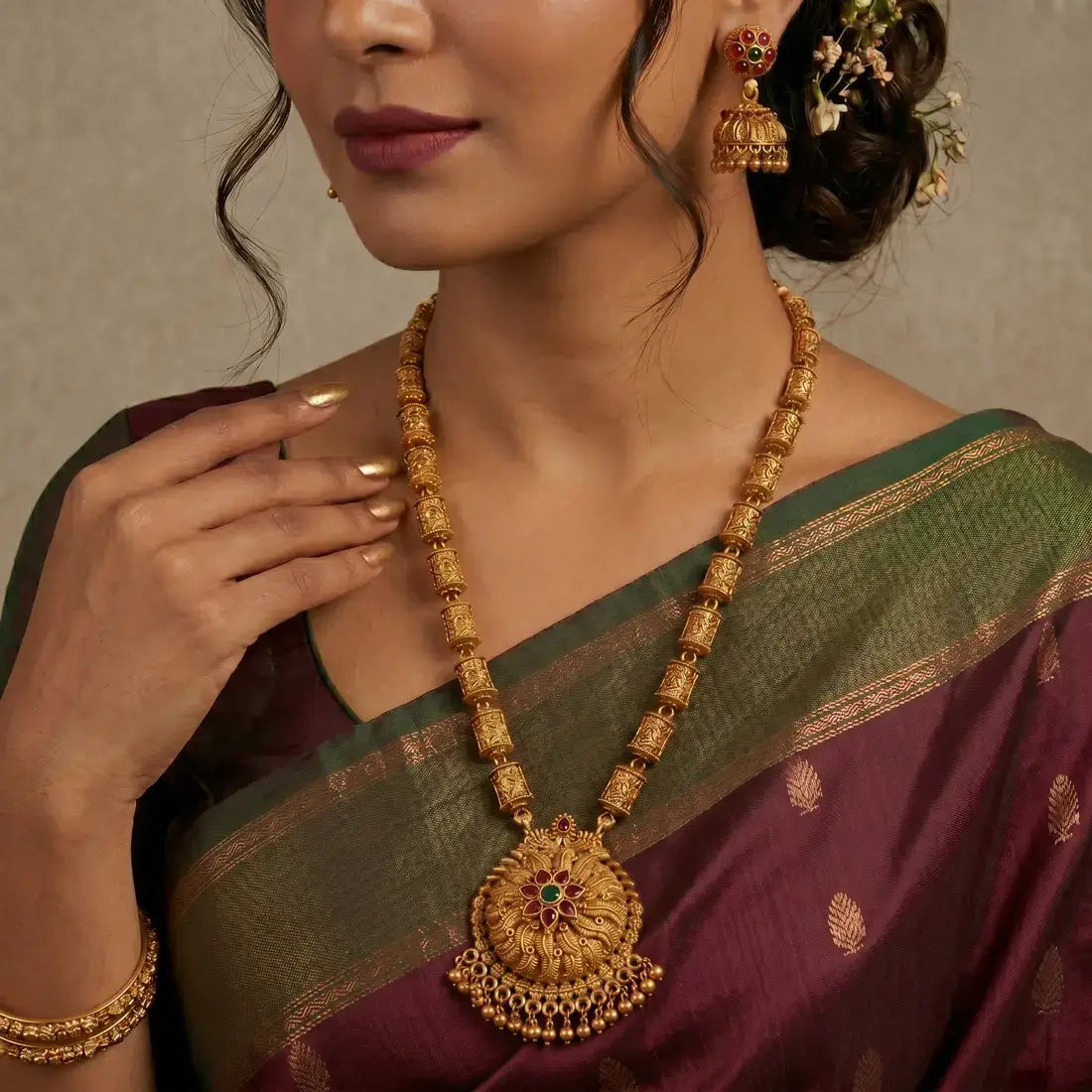 Antique Temple Floral Kemp Stone Long Chain Set worn by a model, showcasing the ornate necklace and jhumka earrings.