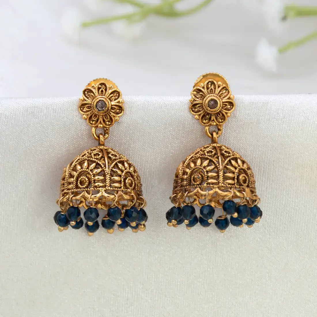 Antique Floral Crystal Hanging Jhumka Earrings with intricate gold design and blue crystal beads.