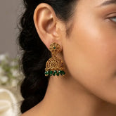 Close-up of Antique Floral Crystal Hanging Jhumka earrings with intricate design and green beads.