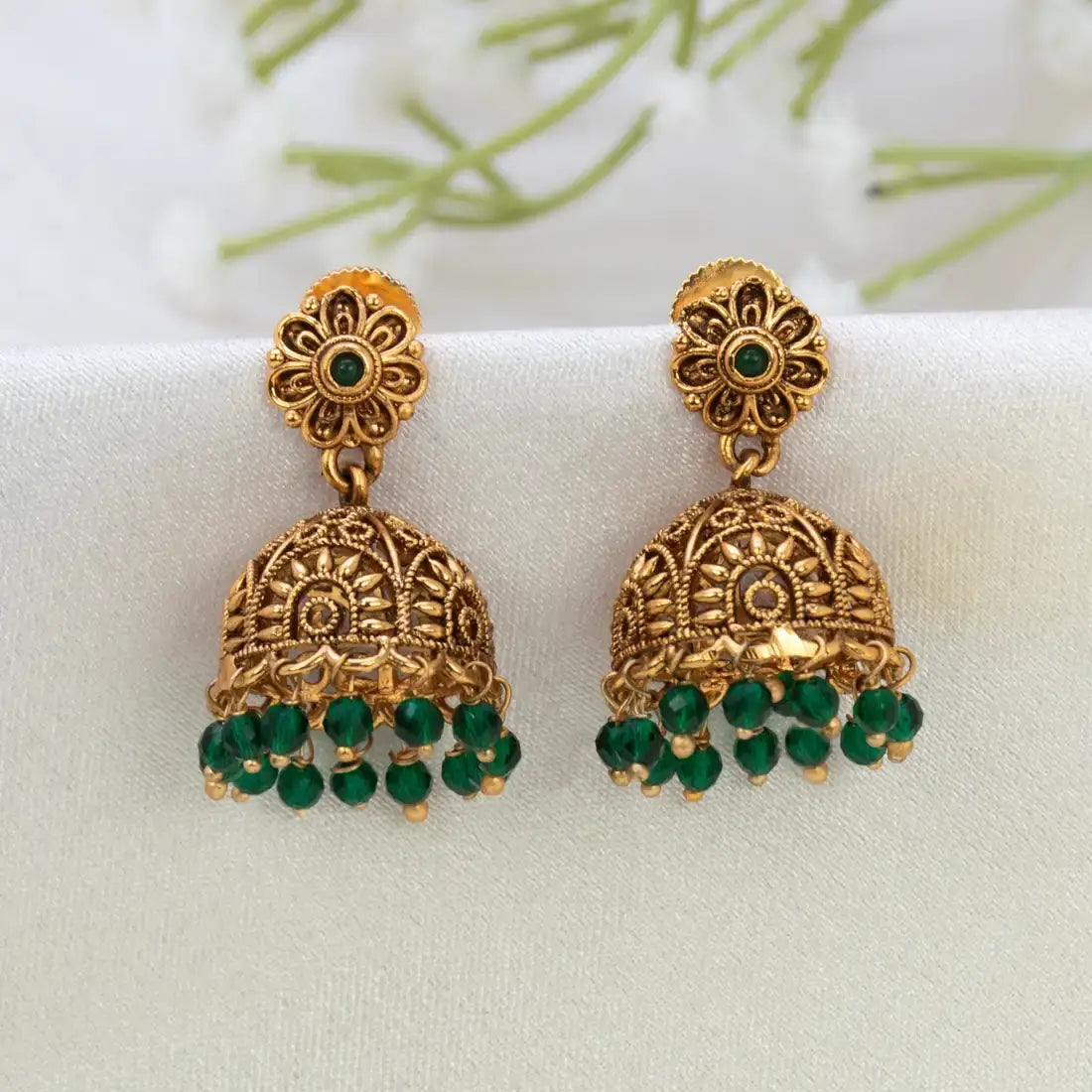 Antique Floral Crystal Hanging Jhumka Earrings with green crystal bead details and floral design.