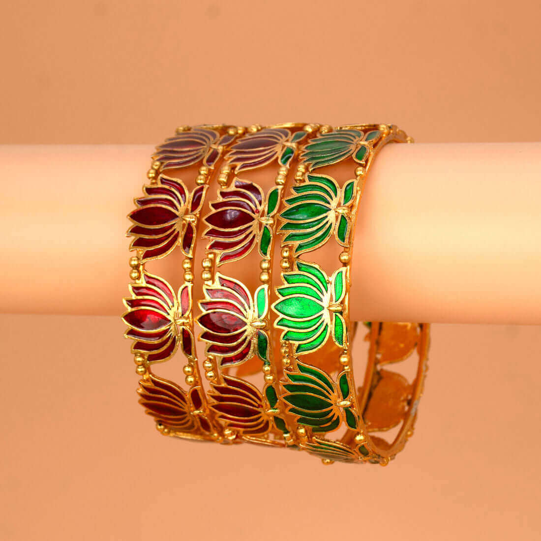 Matte Gold Plated Lotus Enamel Bangle with intricate lotus motifs in red and green enamel.