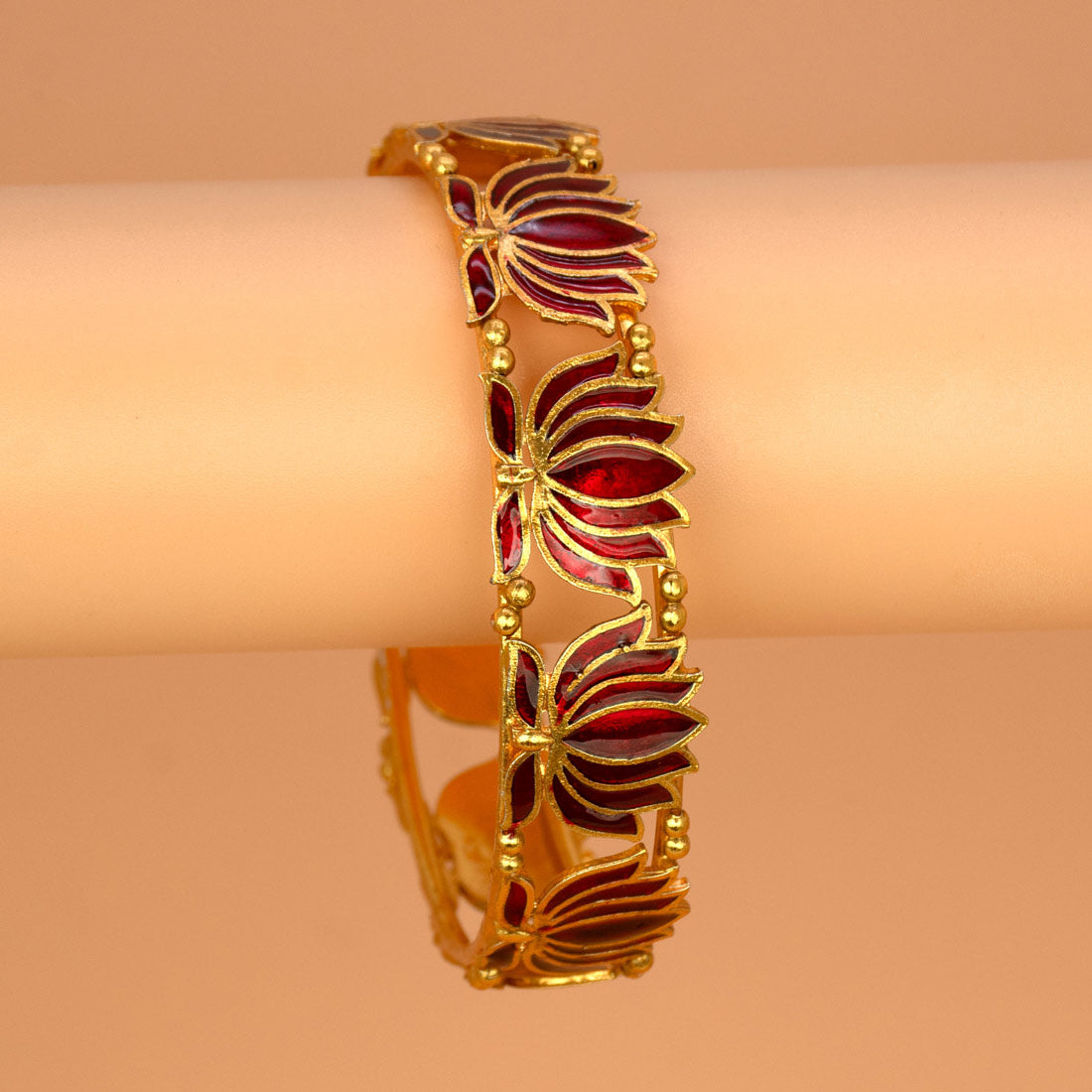 Matte Gold Plated Lotus Enamel Bangle showcasing intricate lotus motifs and rich enamel in dark red.