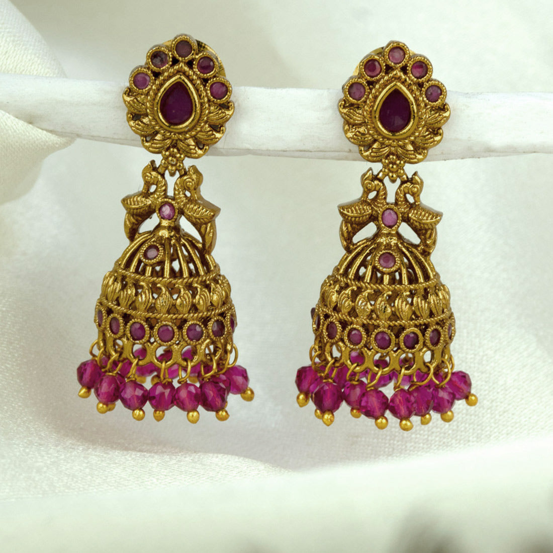 Small Antique Gold Plated Twin Peacock Stone Jhumkas featuring intricate design and colorful beads.
