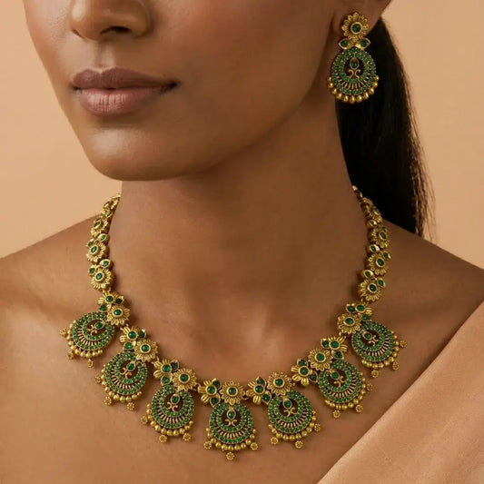 Close-up of a woman wearing Victorian Antique Emerald Stone Necklace Set with chandbali pendants and matching earrings.