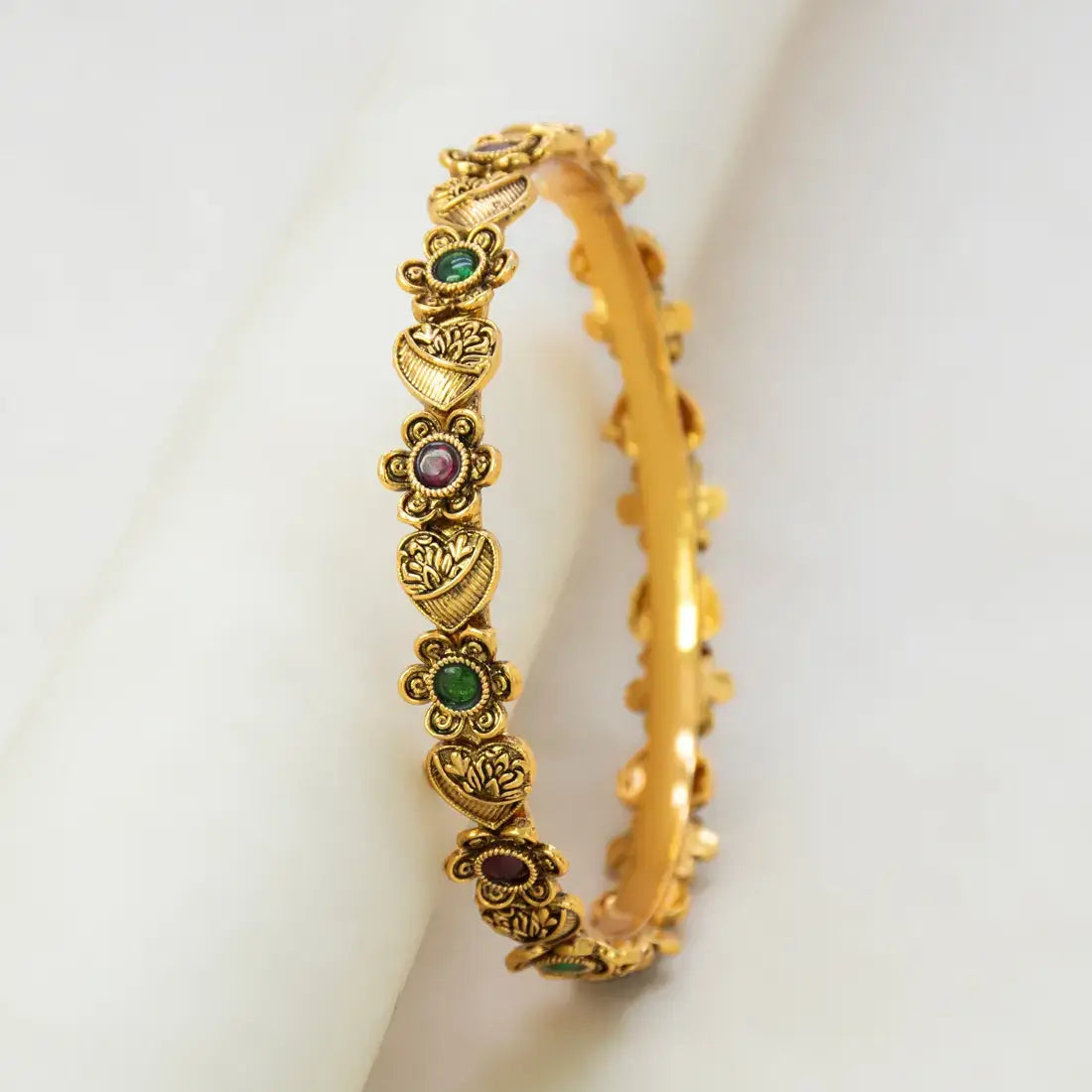 Antique Heart Floral Kemp Stone Victorian Bangle showcasing intricate floral design and colorful stones.
