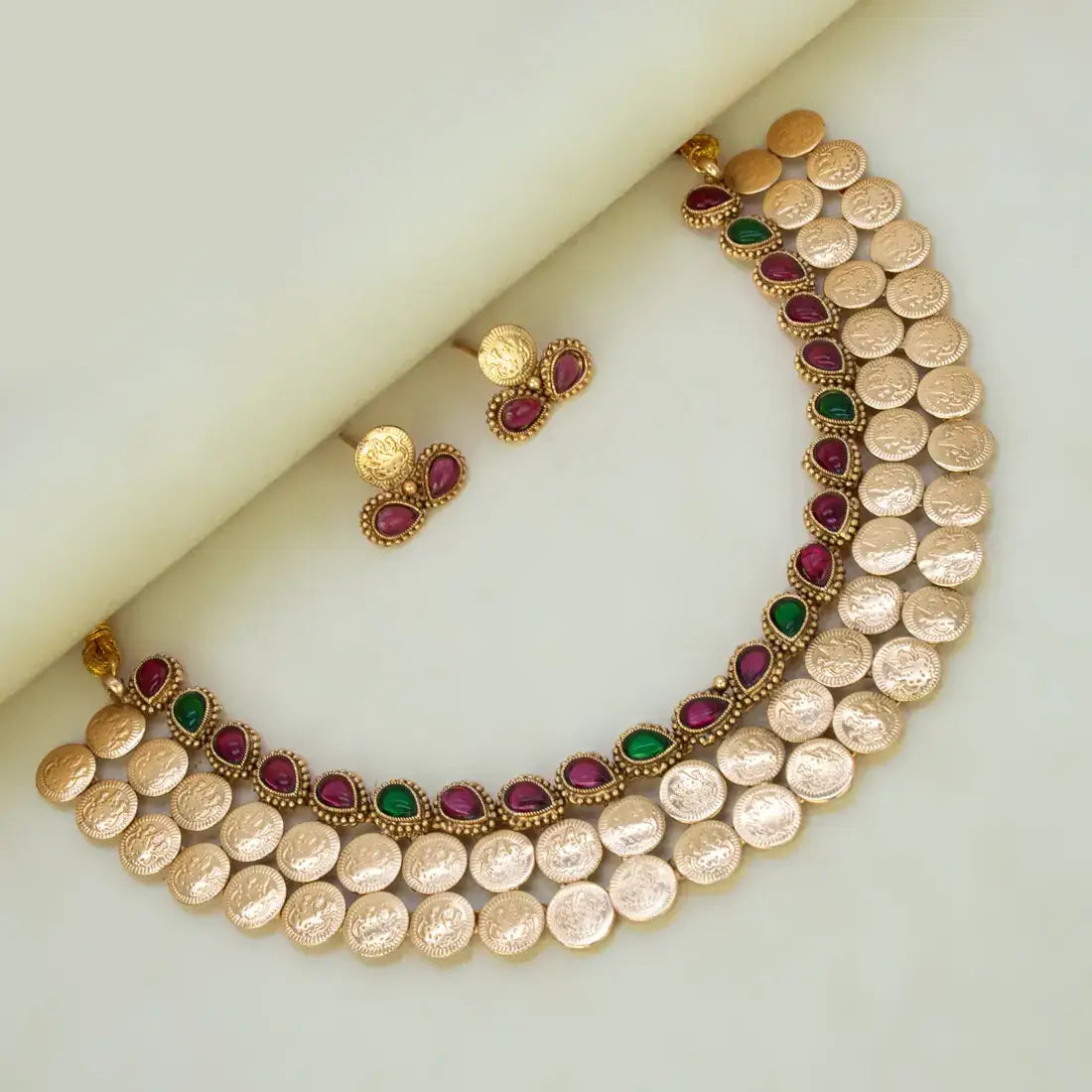 Antique Kemp Stone Lakshmi Kasu Choker Set featuring gold coins and vibrant kemp stones in ruby and emerald colors.