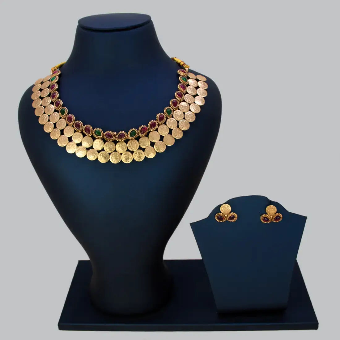 Antique Kemp Stone Lakshmi Kasu Choker Set showcasing a cascade of Lakshmi coins and kemp stones.