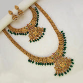 Antique Green Beads Lakshmi Bridal Jewellery Set featuring intricate gold finish and green bead detailing.