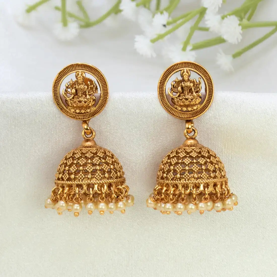 Antique Matte Lakshmi Temple Jhumka featuring brass construction and pearls accents, showcasing Goddess Lakshmi motif.