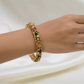 Antique Gold-Plated Lakshmi Multi-Colour Mango Bangle worn on a hand, showcasing intricate designs and colorful enamel detailing.