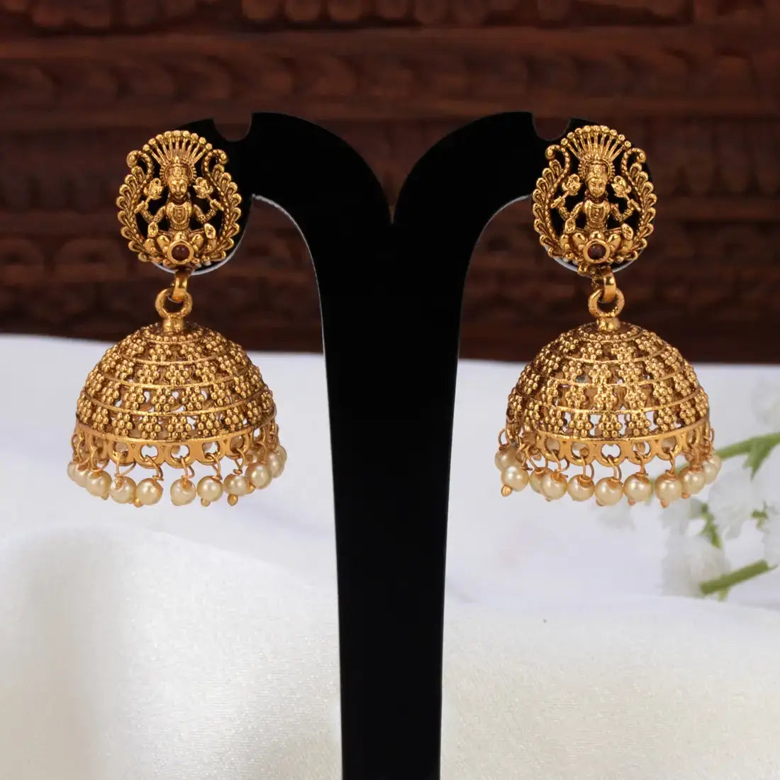 Antique Lakshmi Pearl Hanging Jhumka Earrings featuring Goddess Lakshmi design and pearl embellishments.