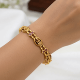 Antique Gold-Plated Lakshmi Ruby Stone Bangle worn on a wrist, showcasing intricate design and Ruby stones.