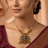 Antique Lakshmi Elephant Temple Pendant Necklace Set displayed on a model, featuring intricate designs and colorful meenakari work.