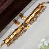 Antique Kemp Pearl Hanging Kerala Elakkathali Choker Set featuring gold-toned motifs and vibrant green and ruby stones.
