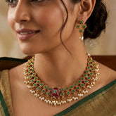 Antique White Pearls Hanging Stone Necklace Set worn by a model with matching earrings and elegant outfit.