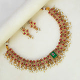Antique White Pearls Hanging Stone Necklace Set with ornate gold, red stones, and matching earrings.