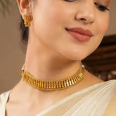 Woman wearing an Antique Single Line Elakkathali Necklace Set with traditional design, showing elegance and beauty.