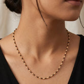 Gold Plated Black and White Pearl Chain Necklace for Women worn by a model.