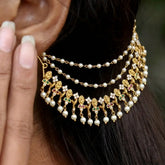 Floral Gold Plated Ruby Emerald CZ Pearl Ear Chain elegantly draping from the ear with pearls and vibrant stones.