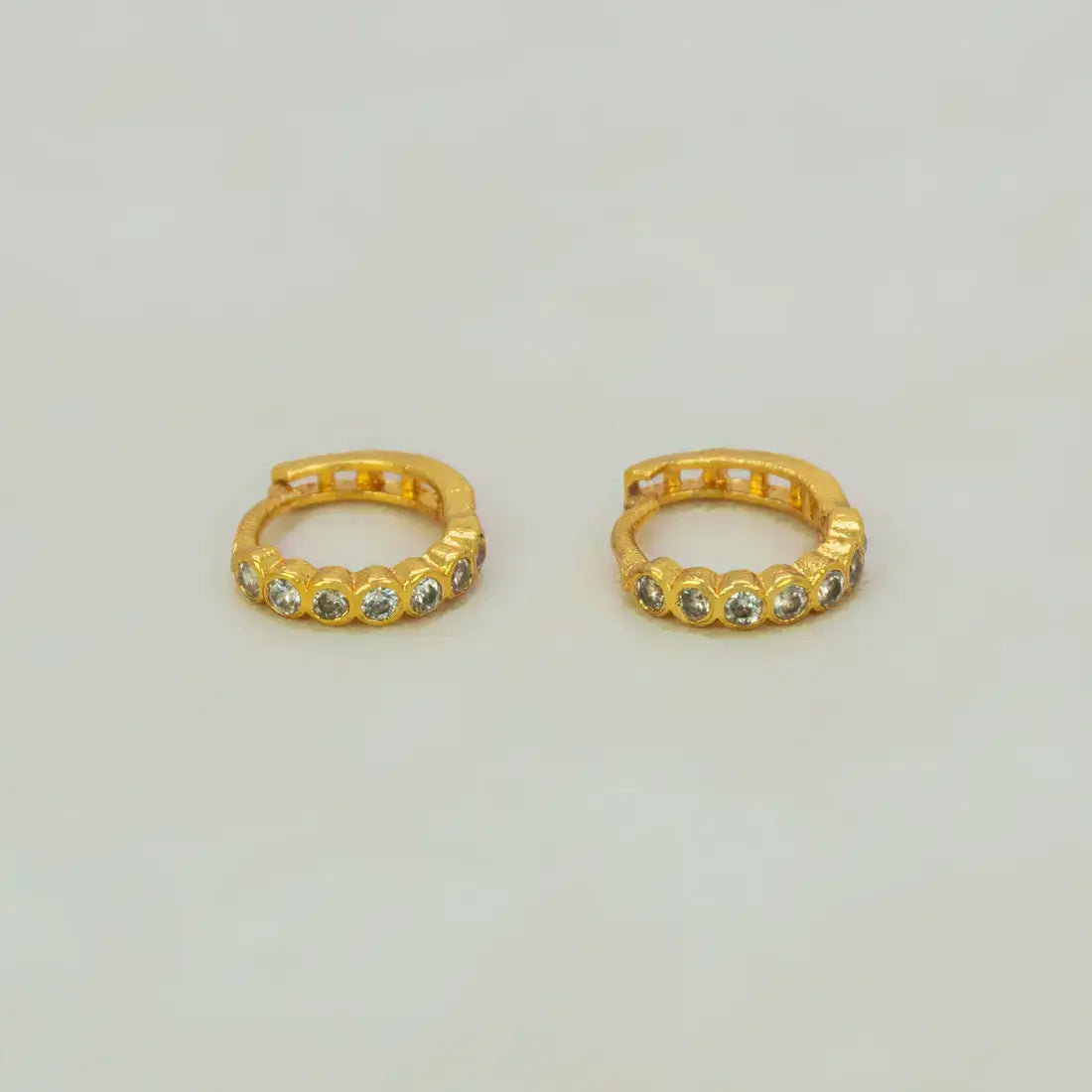 Gold Plated Stone Hoop Earrings for Women featuring cubic zirconia stones in a sleek gold finish.