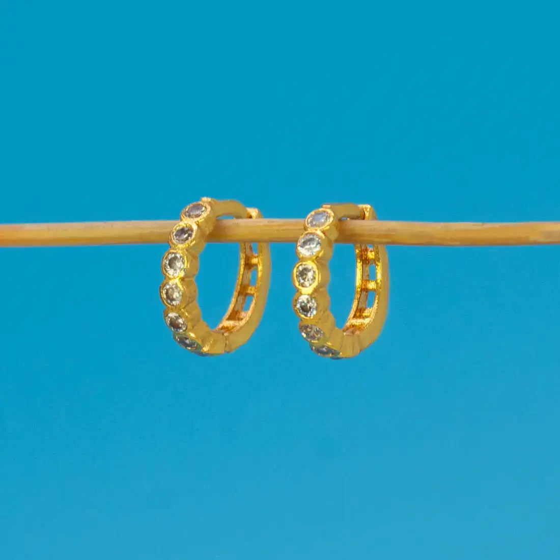 Gold Plated Stone Hoop Earrings for Women with brilliant cubic zirconia stones in a sleek gold finish.