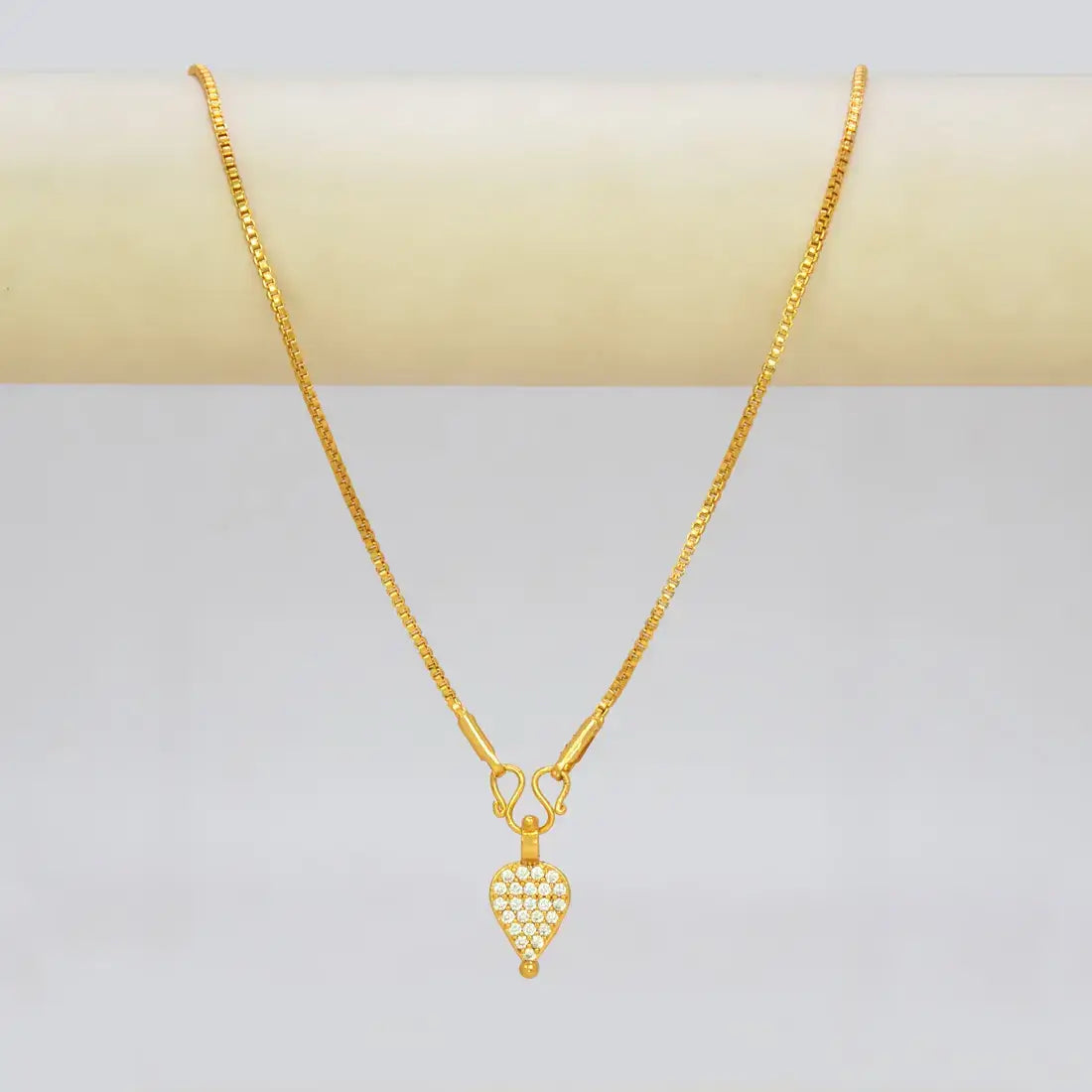 Gold Plated CZ Stone Studded Teardrop Pendant on a delicate chain, showcasing elegant cubic zirconia stones.