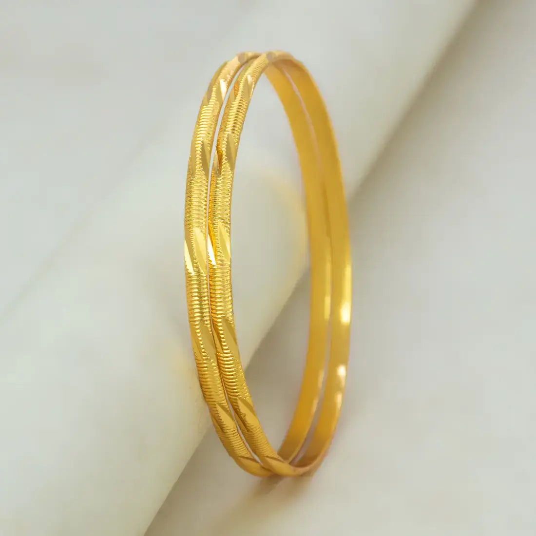 Casual Gold Plated MC Mayoori Bangles elegantly designed with a mix of smooth and textured surfaces.