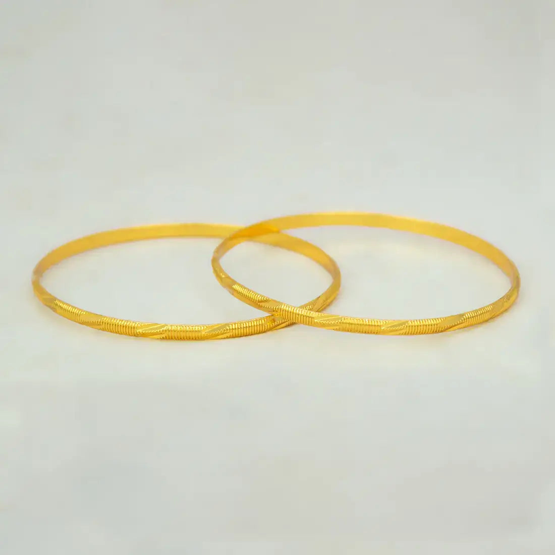 Casual Gold Plated MC Mayoori Bangles, a matching pair of elegantly designed gold bangles.