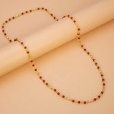 Gold Plated Coral Red Beads Chain featuring coral-red beads on a gold-plated link chain with faceted gold bead accents.
