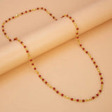 Gold Plated Coral Red Beads Chain featuring coral-red beads on a gold-plated link chain with faceted gold bead accents.