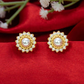 Gold Plated Floar Pearl Stud Earrings on a red background, featuring a floral design with large and small pearls.