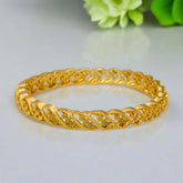 Plain Gold Plated Designer Bangle showcasing intricate twisted patterns, perfect for elevating any outfit.