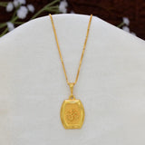 Devotional Unisex Gold Plated Rectangle Om Pendant featuring an Om symbol engraved on a textured rectangular pendant with chain, displayed on a white jewellery bust.