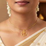Simple Gold-Plated Floral Pendant With Chain worn elegantly with a saree underneath flowers.