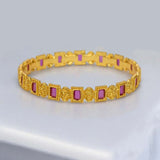 Elegant Rectangle Ruby Stone Bangle featuring intricate gold detailing and vibrant ruby stones.