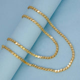 Elegant Designer Gold Plated Chain -10 P displayed on a blue background, showcasing its unique oval disc pattern.