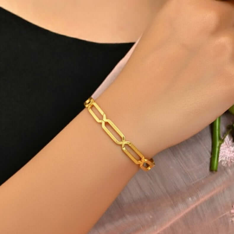 Elegant Gold Plated Link Design Plain Bangle worn on a woman's wrist, showcasing its unique square link design.
