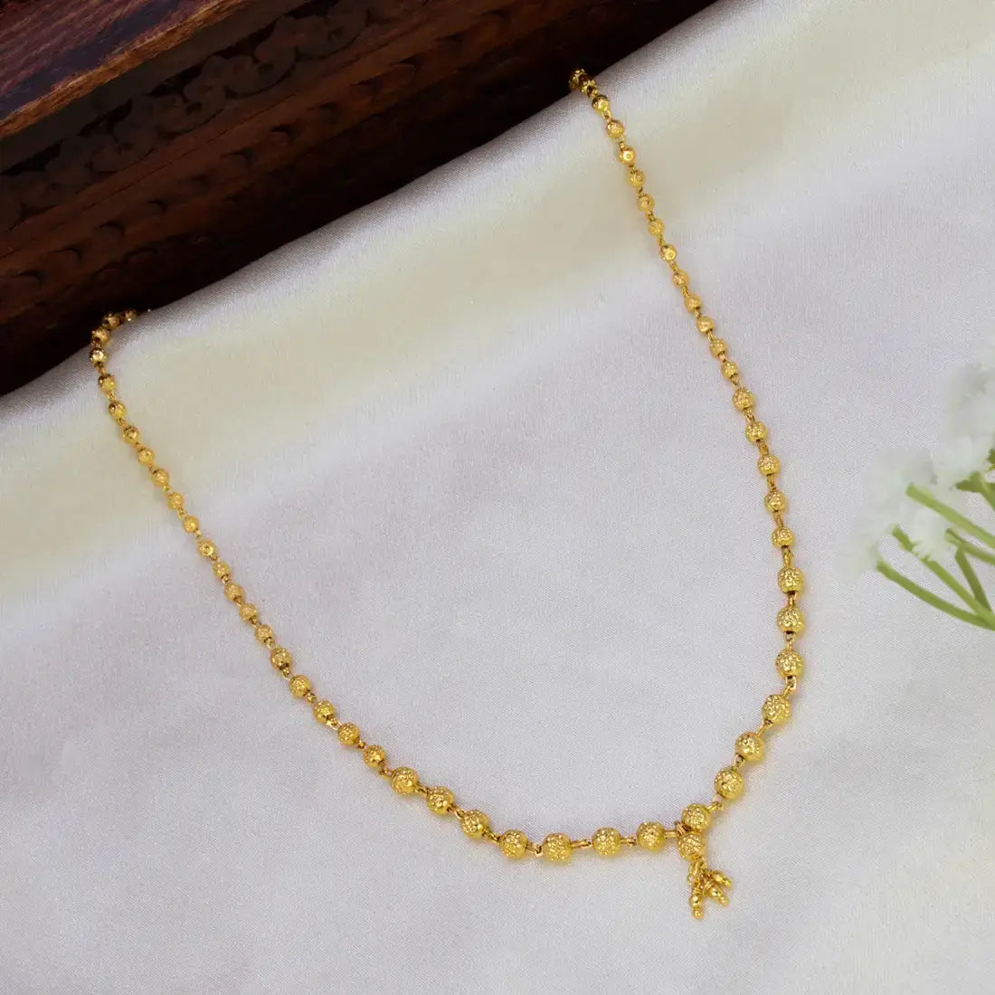 Gold Plated Designer Ball Chain Necklace with textured golden beads on a soft background.