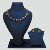 Floral Kemp Stone Antique Gold Choker Necklace Set displayed on a jewelry stand with matching earrings.
