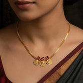 Gold Plated Triple Floral Ruby Lakshmi Kasu Necklace worn gracefully, featuring intricately designed kasu pendants and a sleek gold chain.