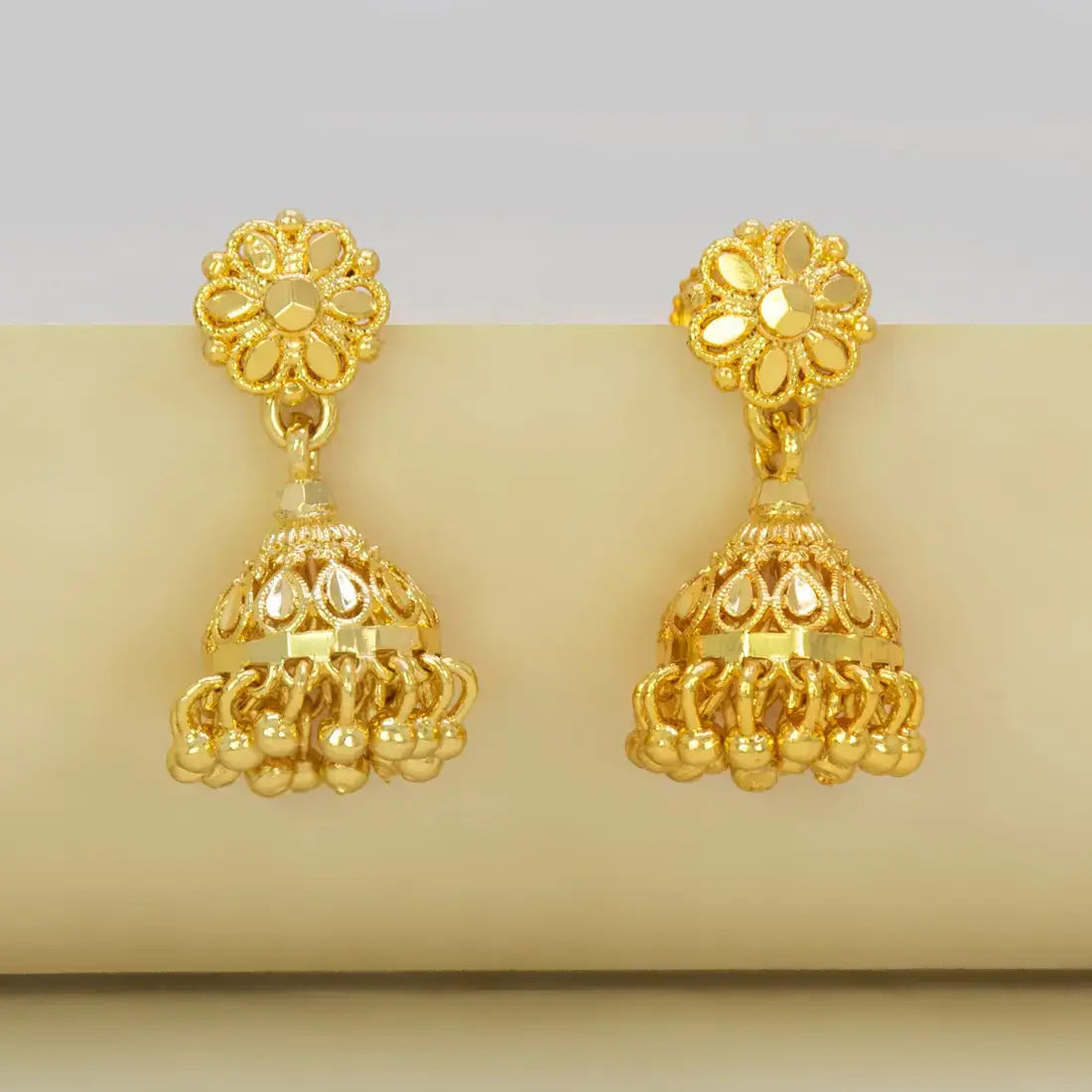 Gold-Plated Small Floral Jhumka Earrings showcasing intricate floral design and cascading gold ball drops.