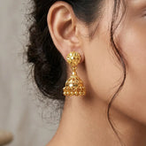 Gold-Plated Small Floral Jhumka Earrings showcasing a floral stud top and cascading polished gold ball drops.