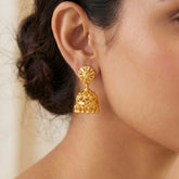 Gold-Plated Small Floral Jhumka earrings showcased on a woman, highlighting traditional Indian craftsmanship.